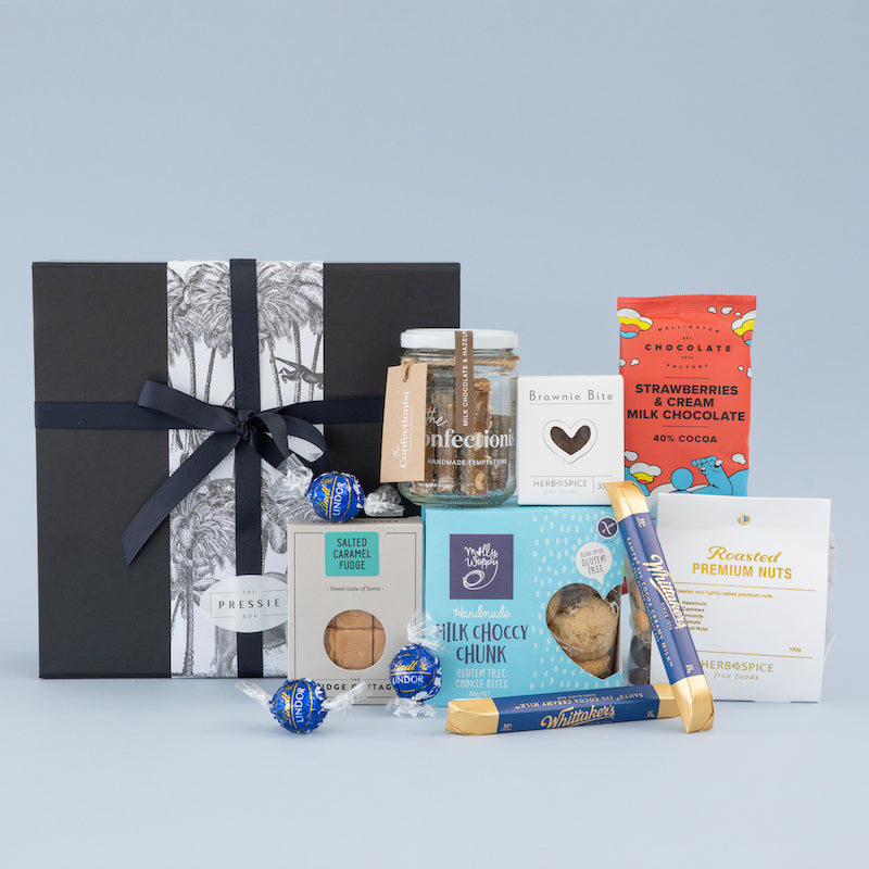 Luxury men’s gift hamper with gourmet chocolate, cookies, toffee, and nuts packaged in a smart black gift box. 