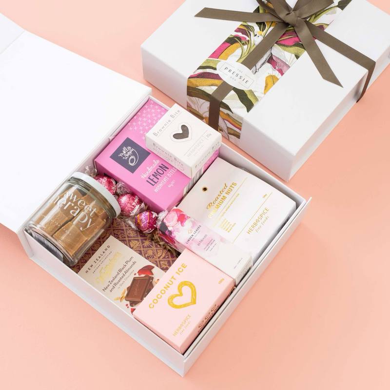 The Women’s Luxe gift box featuring gourmet treats and indulgent goodies, beautifully presented in a stylish gift box.